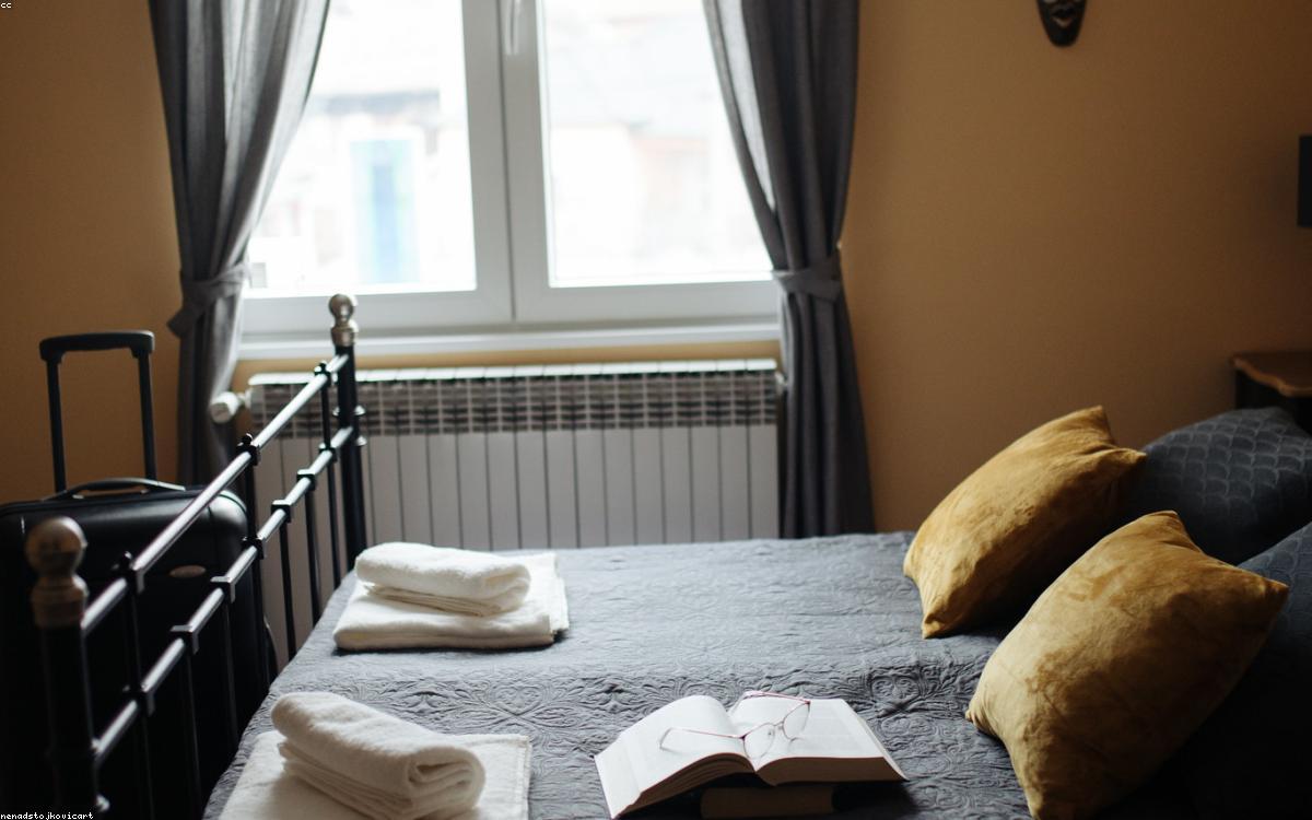 Blackout curtains in a dark, cozy bedroom