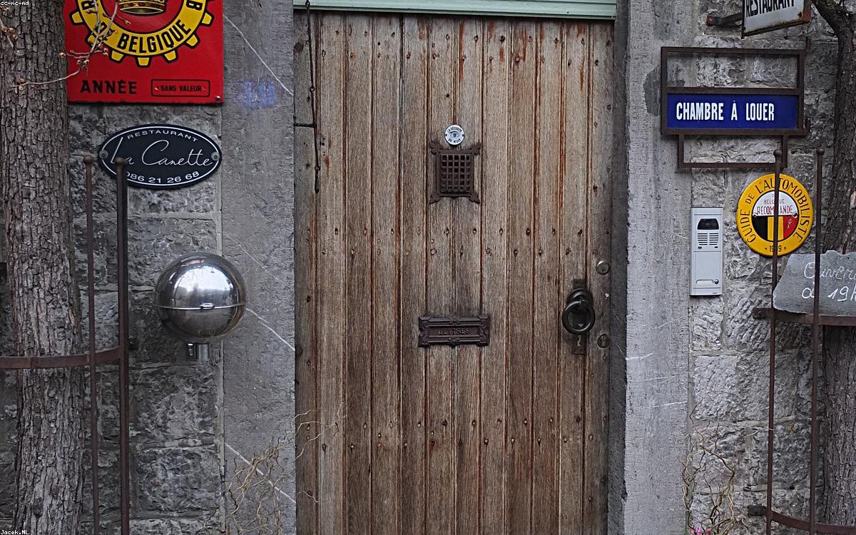 A durable coir doormat at a front door entrance
