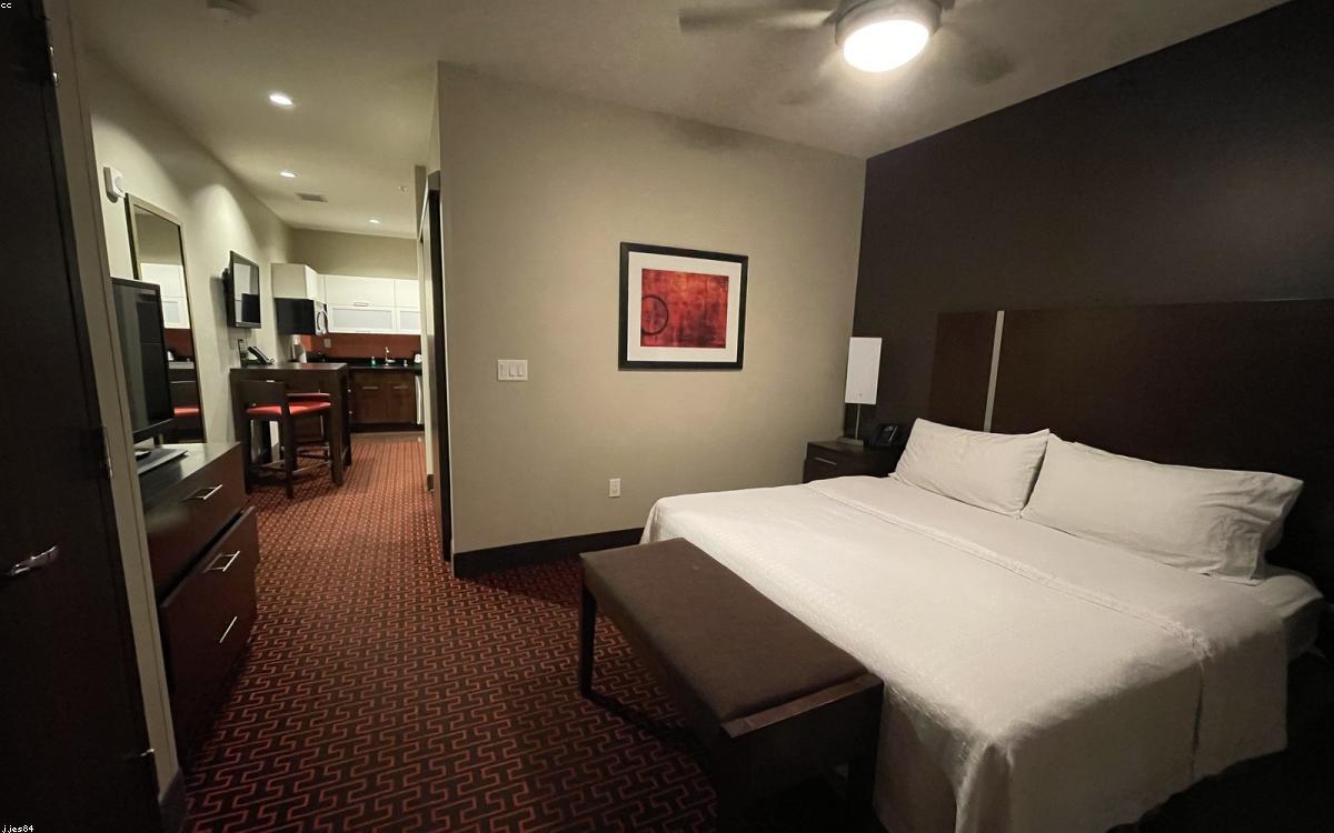 A memory foam mattress topper on a bed in a cozy bedroom