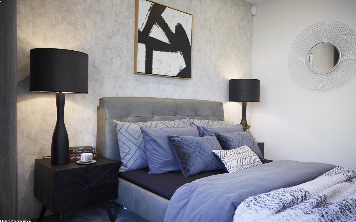 A warm table lamp on a wooden side table beside a sofa